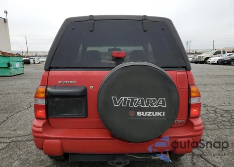 1999 Suzuki Vitara Ja from USA, damaged, VIN 2S3TA52C1X6102618